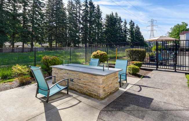 Community Fire Pit Area at Landings at Morrison Apartments located in Gresham, OR.
