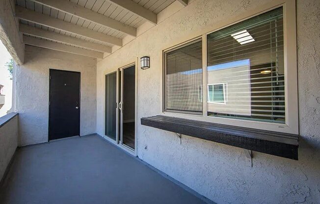 a large window on the side of a building with a door at Aspire Upland Apartments, Upland