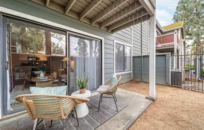 Outdoor patio area with sliding glass door to personal apartment at Citrine Hills, California