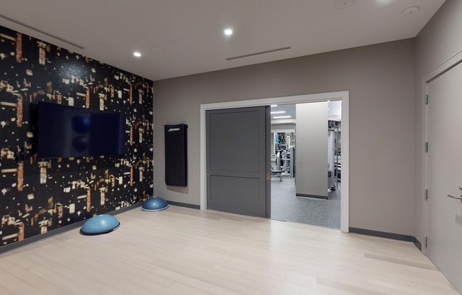 Club-quality fitness studio featuring a group fitness area and yoga/Pilates studio
