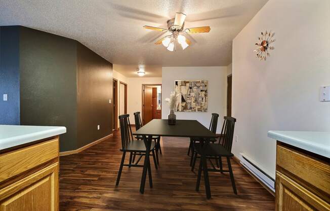 Fargo, ND Oxford Apartments. a dining room with a table and chairs