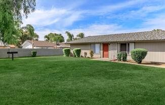a large lawn in front of a house