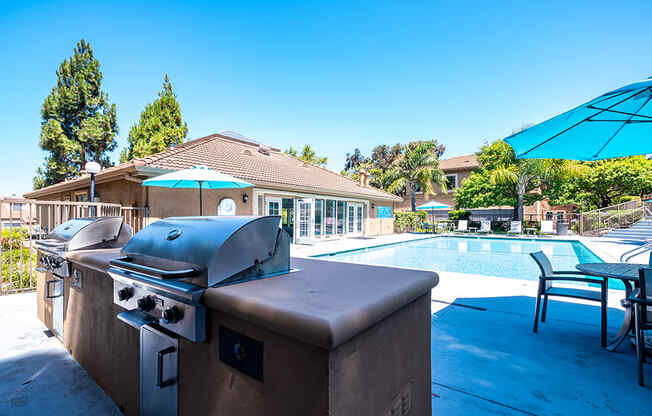 BBQ area by pool with seating