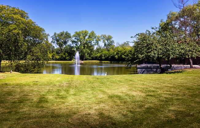 pond with water fountain on The Bennington Apartments property