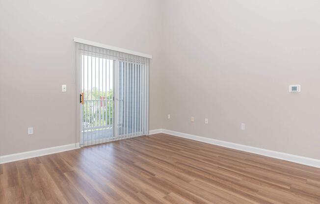 a large empty room with a wood floor