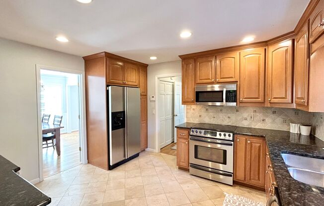 Fabulous Dunwoody Property Situated in a Perfect Location!  Hardwoods, Stainless, Granite!