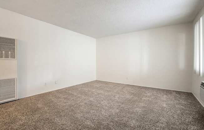 Living room with air conditioning, carpeted flooring