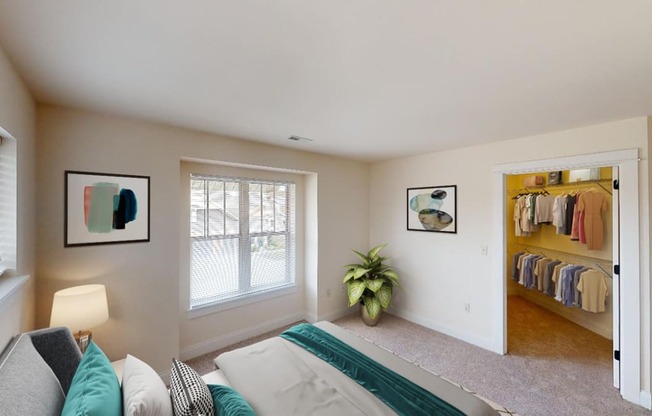 a bedroom with a bed and a closet