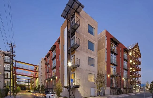 a large apartment building with a street in front of it