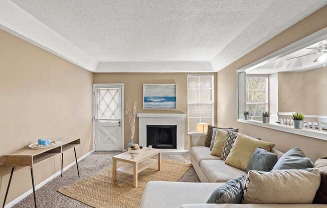 a living room with a couch and a fireplace