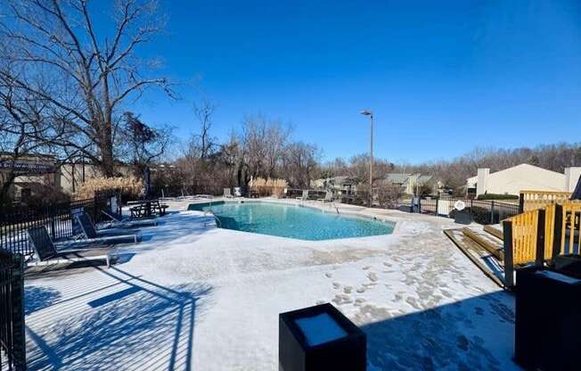 A pool surrounded by snow.