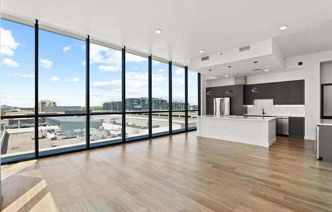 A modern kitchen with a view of the city.
