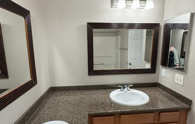 a bathroom with a sink and a mirror