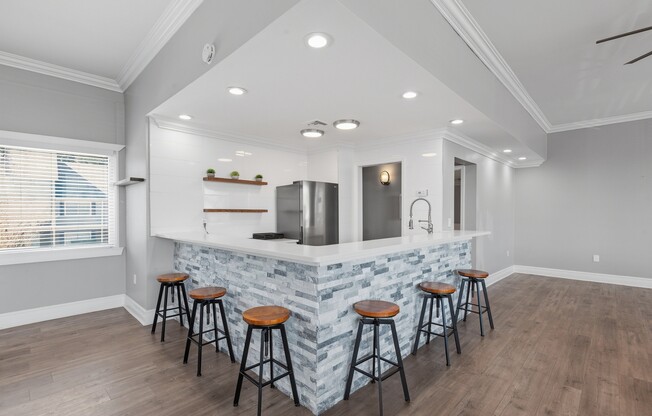 Welcome to Wymore 360 Apartments, where modern living meets stylish design. Enjoy a fully-equipped kitchen with elegant finishes and ample seating for entertaining. Elevate your lifestyle today—schedule a tour and see for yourself!