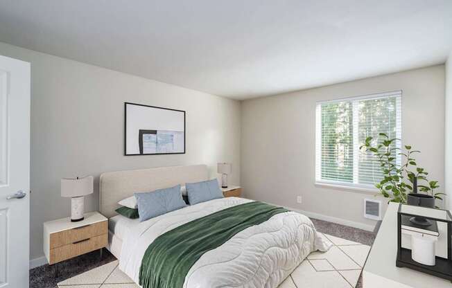 Sunlit bedroom with large window at 3030 Lake City Apartments near 3030 NE 143rd St