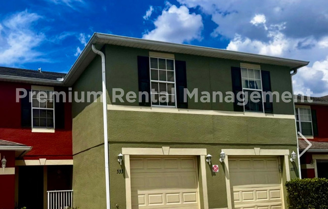 3 bedroom 2.5 bath Oakcrest Townhome with Laminate and Tile flooring Throughout, and a 1 Car Garage!