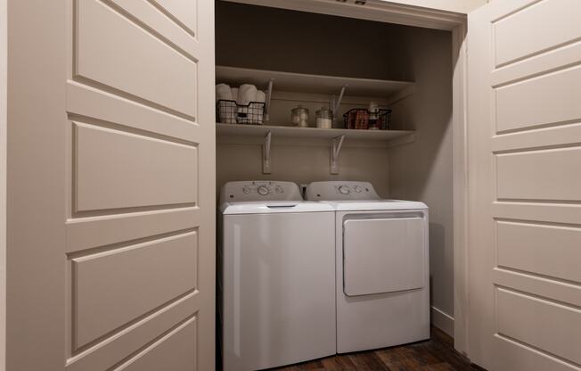 a small laundry room with a washer and dryer