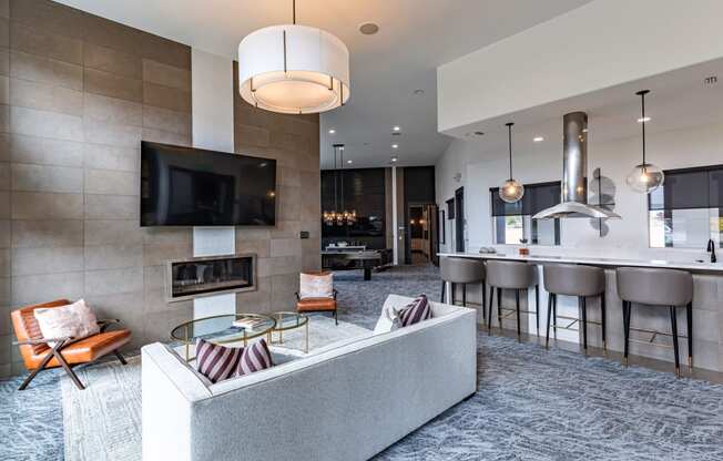 a living room with a couch and a table with chairs