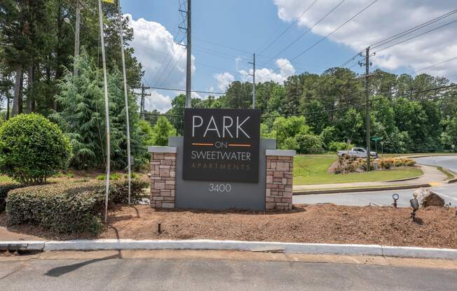 the park on sweetwater apartments entrance sign