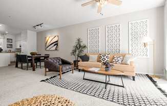 a living room with grey walls and white carpet