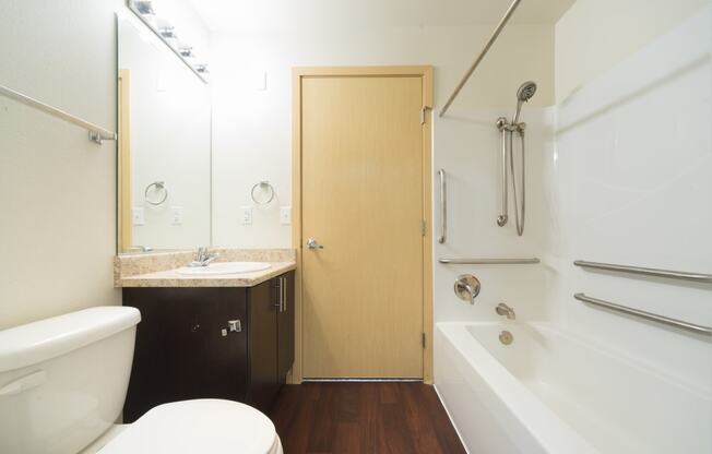 a bathroom with a toilet sink and bathtub