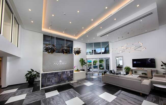 a lobby with couches and a television at Saba Pompano Beach, Pompano Beach, 33062