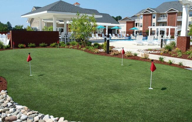 outdoor putting green for enterainment and recreation at 1200 Acqua Apartment homes