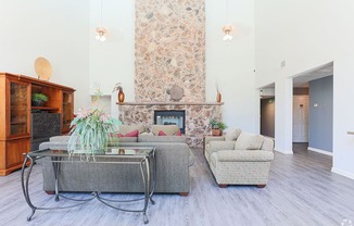 Ashford Park resident lounge area with fireplace and couches