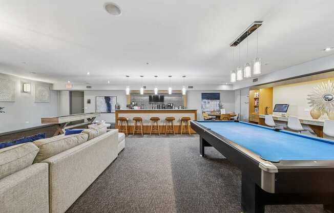 Resident lounge with billiards table and comfortable seating at River 595