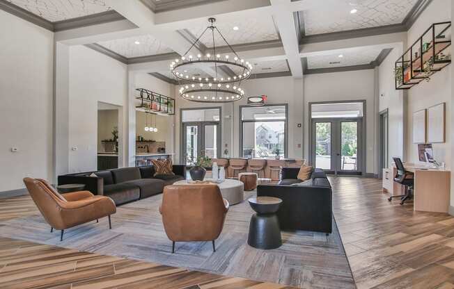 a large lobby with couches and chairs and a large chandelier at Sladestone Shadow Creek, Pearland, TX, 77584