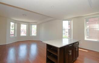 a kitchen with an island in the middle of a room