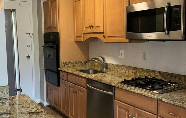 Luxury 2-bedroom 2-bath condo in Grosvenor Park with 1 reserved garage parking space.