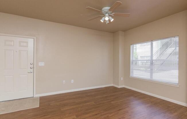 Large apartment living room with ceiling fanÂ 