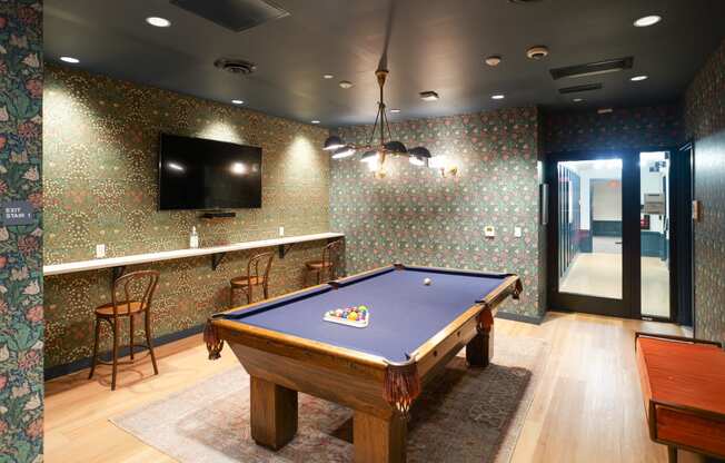 a game room with a pool table and a tv at The Commonwealth Building, Pittsburgh, 15222