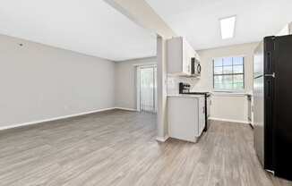 a kitchen and living room in a 555 waverly unit