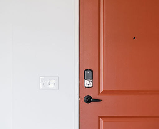 a red door with a white door next to it at The Landing at 1001 NP, Fargo, North Dakota 58102