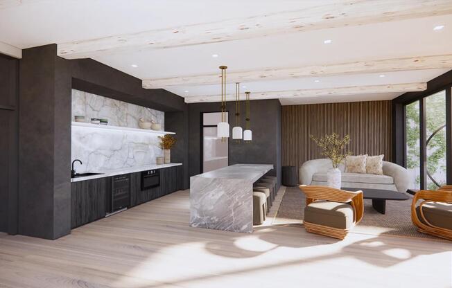 Entertaining space with catering kitchen, cozy seating, and ocean views.