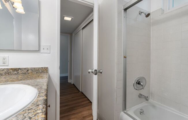 a bathroom with a bathtub and a sink