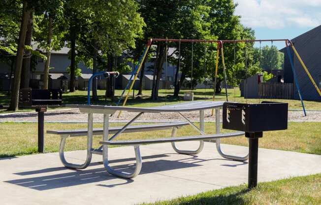 Playground with grilling stations at Woodlake Apartments