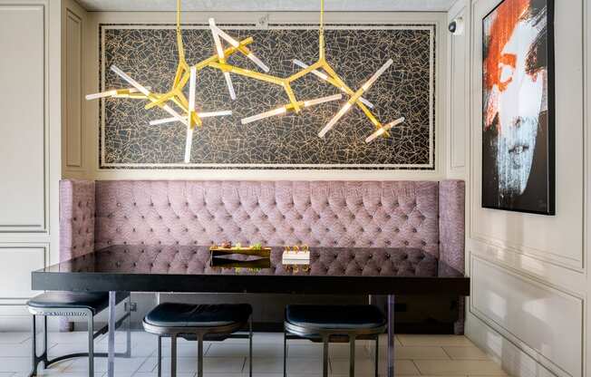 a dining room with a table and chairs and a chandelier