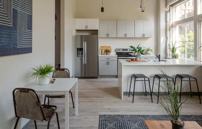 a small apartment with a kitchen and dining area at The 22 Apartments, Missouri, 63103