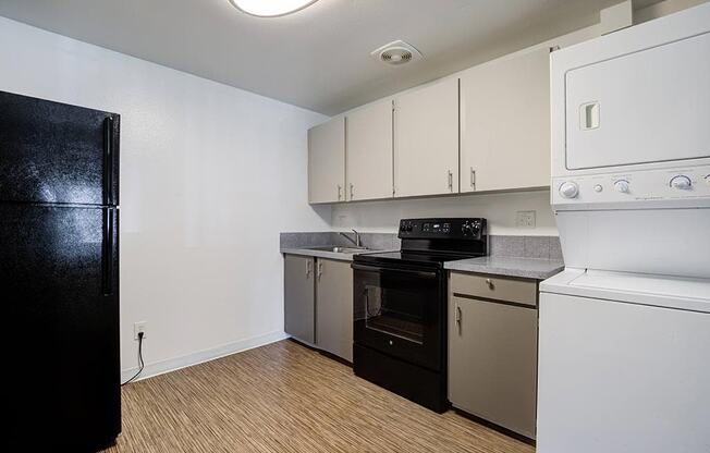 a kitchen with a stove refrigerator and dishwasher