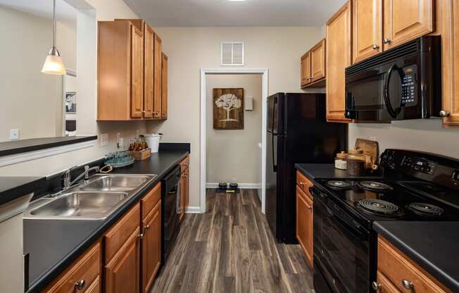 Black Kitchen Appliances at Abberly Woods Apartment Homes, North Carolina 28216