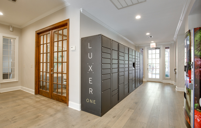 View of Luxer One Package Lockers with Wood Floors and Hallway at Raveneaux Apartments