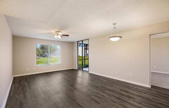 Living Room with Wood Style Flooring at Lakeside Glen Apartments, Melbourne, FL, 32904