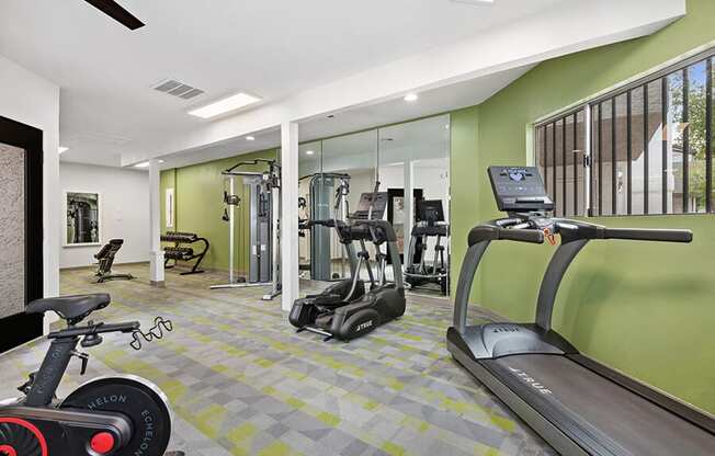 Community Fitness Center with Equipment at Crystal Creek Apartments in Phoenix, AZ.