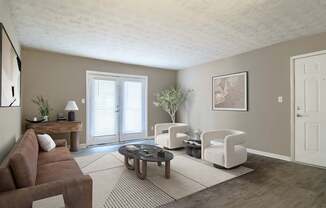 “Living room with large window door providing abundant natural light and access to outdoor space in a pet-friendly home at Stratford Ridge Apartments in Marietta, GA.