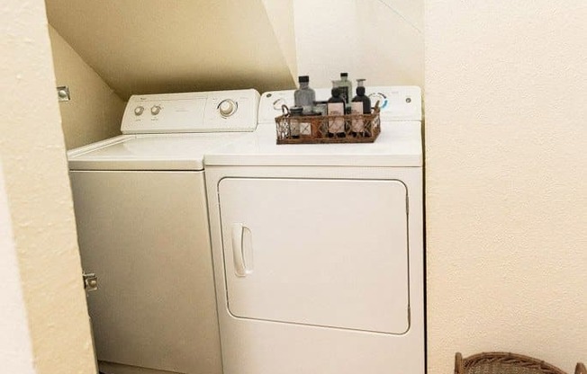 a washer and dryer in a small laundry room