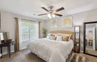 the preserve at ballantyne commons bedroom with ceiling fan and large bed