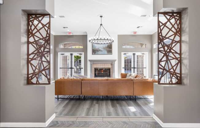 a living room with a couch and a fireplace